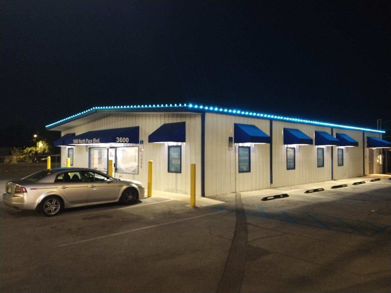 Commercial building lit with blue LED roofline lights